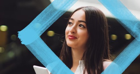 1. A woman holding a tablet displaying the phrase "the future of work," symbolizing modern workplace trends and technology.