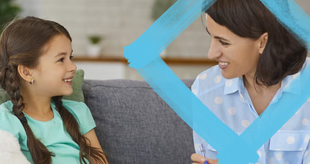 1. A woman and a young girl sit together on a couch, holding a teddy bear, sharing a moment of warmth and affection.