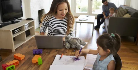 A parent successfully balancing demanding postgraduate study requirements with busy family life and responsibilities.