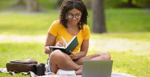 Dedicated student reviewing course materials online to advance their educational and professional journey.